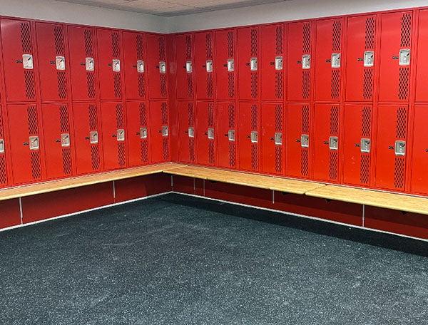 red lockers with a bench in front