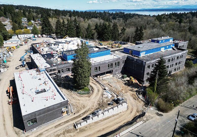 aerial view of a multi story building with construction work going on